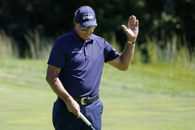 Phil Mickelson reacts to missing a putt on the ninth green in the first round of the Northern Trust golf tournament at TPC Boston, Thursday, Aug. 20, 2020, in Norton, Mass. (AP Photo/Charles Krupa)