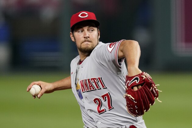 Cincinnati Reds starting pitcher Trevor Bauer throws during the seventh inning of game two of a baseball doubleheader against the Kansas City Royals Wednesday, Aug. 19, 2020, in Kansas City, Mo. The Reds won 5-0. (AP Photo/Charlie Riedel)