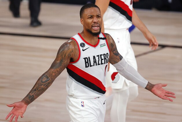 Portland Trail Blazers' Damian Lillard reacts to a call during the second quarter of the team's NBA basketball game against the Philadelphia 76ers on Sunday, Aug. 9, 2020, in Lake Buena Vista, Fla. (Kevin C. Cox/Pool Photo via AP)