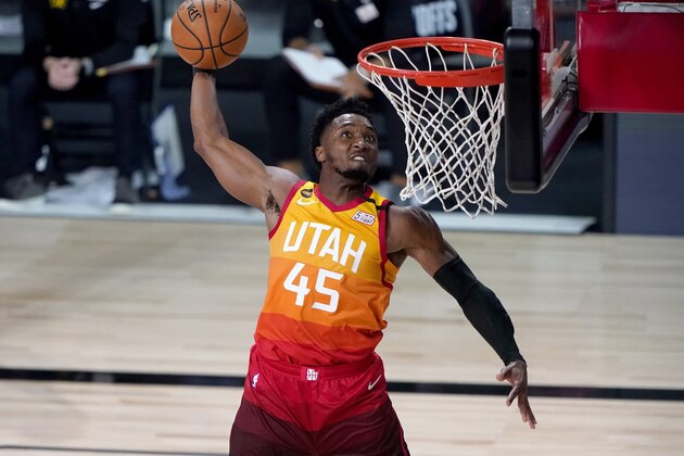 Utah Jazz's Donovan Mitchell (45) dunks against the Denver Nuggets during the second half of an NBA basketball first round playoff game Friday, Aug. 21, 2020, in Lake Buena Vista, Fla. (AP Photo/Ashley Landis, Pool)