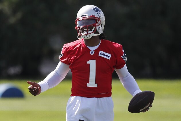 New England Patriots quarterback Cam Newton (1) holds the ball during an NFL football training camp practice, Friday, Aug. 21, 2020, in Foxborough, Mass. (AP Photo/Michael Dwyer, Pool)