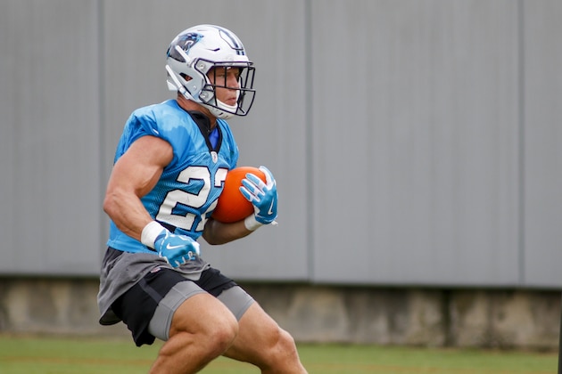 Carolina Panthers running back Christian McCaffrey carries the football during a drill at the NFL football team's training camp practice Sunday, Aug. 16, 2020 in Charlotte, N.C. (AP Photo/Nell Redmond)