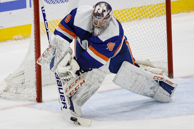 New York Islanders goaltender Semyon Varlamov (40) makes a save during the third period of an NHL hockey game against the San Jose Sharks, Sunday, Feb. 23, 2020, in Uniondale, N.Y. (AP Photo/John Minchillo)