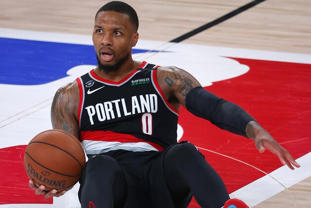 Portland Trail Blazers' Damian Lillard reacts during the fourth quarter against the Los Angeles Lakers in Game 1 of an NBA basketball first-round playoff series, Tuesday, Aug. 18, 2020, in Lake Buena Vista, Fla. (Mike Ehrmann/Pool Photo via AP) Portland Trail Blazers' Damian Lillard reacts during the fourth quarter against the Los Angeles Lakers in Game 1 of an NBA basketball first-round playoff series, Tuesday, Aug. 18, 2020, in Lake Buena Vista, Fla. (Mike Ehrmann/Pool Photo via AP)