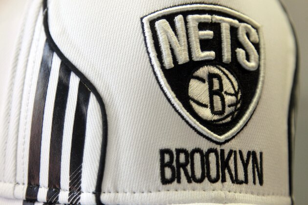 A hat bearing the new logo of the Brooklyn Nets is displayed during a news conference to unveil the new logos of the Brooklyn Nets in New York, Monday, April 30, 2012.  The Nets will be moving from New Jersey to the new Barclays Center in Brooklyn, New York for the 2012-2013 NBA basketball season. (AP Photo/Seth Wenig)