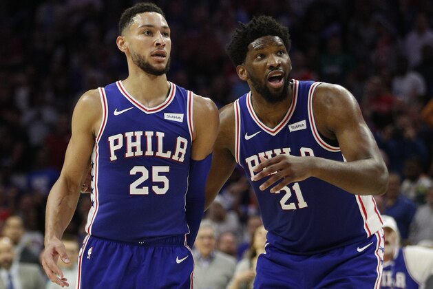Philadelphia 76ers' Ben Simmons, left, of Australia, watches with Joel Embiid, right, of Cameroon, to see if his shot goes in during the first half in Game 5 of a first-round NBA basketball playoff series against the Brooklyn Nets, Tuesday, April 23, 2019, in Philadelphia. (AP Photo/Chris Szagola)