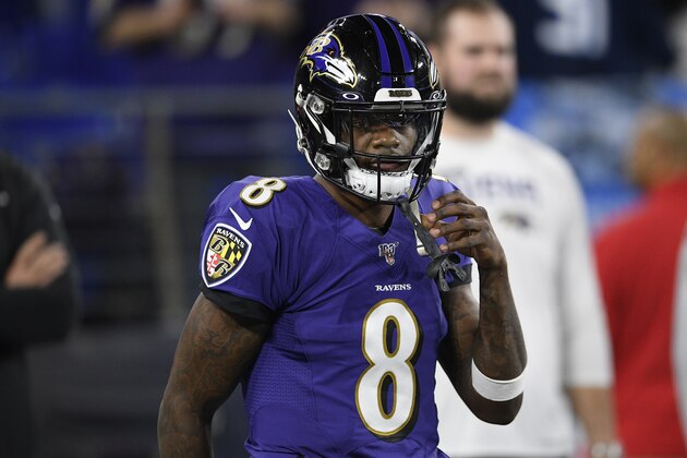 Baltimore Ravens quarterback Lamar Jackson (8) warms up before an NFL divisional playoff football game against the Tennessee Titans, Saturday, Jan. 11, 2020, in Baltimore. (AP Photo/Nick Wass)