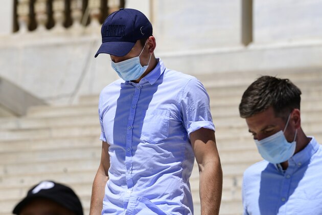 England soccer player Harry Maguire leaves a court building on the Aegean island of Syros, Greece, on Saturday, August 22, 2020. The Manchester United captain was arrested during a brawl on the neighbouring holiday island of Mykonos. (AP Photo/Michalis Varaklas)