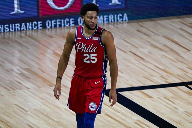 Philadelphia 76ers guard Ben Simmons (25) walks up the court during the first half of an NBA basketball game against the Washington Wizards Wednesday, Aug. 5, 2020 in Lake Buena Vista, Fla. (AP Photo/Ashley Landis)