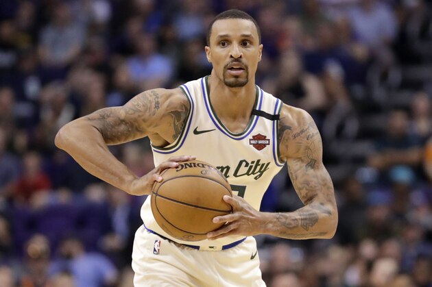 Milwaukee Bucks guard George Hill against the Phoenix Suns during the second half of an NBA basketball game Sunday, March 8, 2020, in Phoenix. (AP Photo/Matt York)