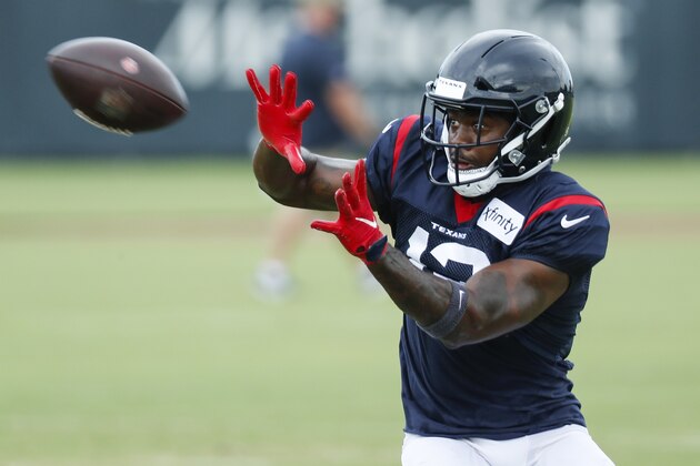 Houston Texans wide receiver Brandin Cooks reaches out to make a catch during an NFL training camp football practice Monday, Aug. 24, 2020, in Houston. (Brett Coomer/Houston Chronicle via AP, Pool)