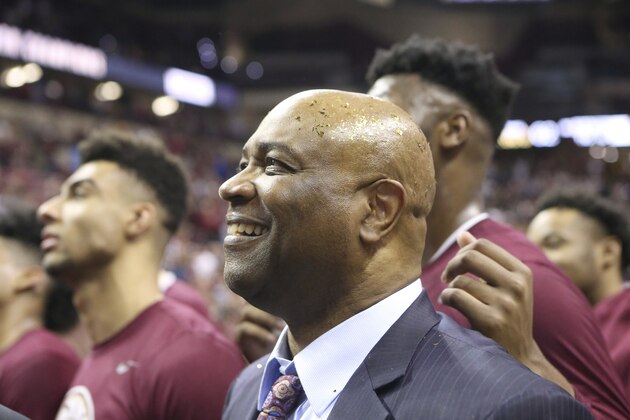 FILE - In this March 7, 2020, file photo, Florida State's head coach Leonard Hamilton celebrates with his team after their first ever ACC championship after an NCAA college basketball game against Boston College in Tallahassee, Fla. Hamilton was selected Associated Press Atlantic Coast Conference Coach of the Year Tuesday, March 10, 2020. (AP Photo/Steve Cannon, File)