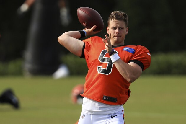 Cincinnati Bengals' Joe Burrow throws a pass during an NFL football camp practice in Cincinnati, Friday, Aug. 21, 2020. (AP Photo/Aaron Doster)