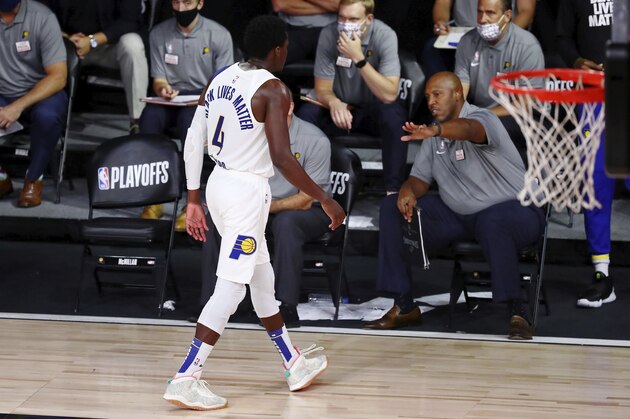 Indiana Pacers guard Victor Oladipo (4) walks off the court after fouling out against the Miami Heat during the second half of Game 3 of an NBA basketball first-round playoff series, Saturday, Aug. 22, 2020, in Lake Buena Vista, Fla. (Kim Klement/Pool Photo via AP)