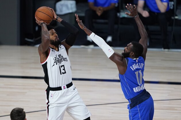 Dallas Mavericks' Tim Hardaway Jr. (11) covers Los Angeles Clippers' Paul George (13) during the first half of an NBA basketball first round playoff game Tuesday, Aug. 25, 2020, in Lake Buena Vista, Fla. (AP Photo/Ashley Landis, Pool)