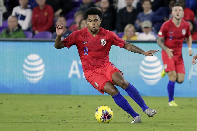 United States midfielder Weston Mckennie (8) moves the ball against Canada during the second half of a CONCACAF Nations League soccer match Friday, Nov. 15, 2019, in Orlando, Fla. (AP Photo/John Raoux)