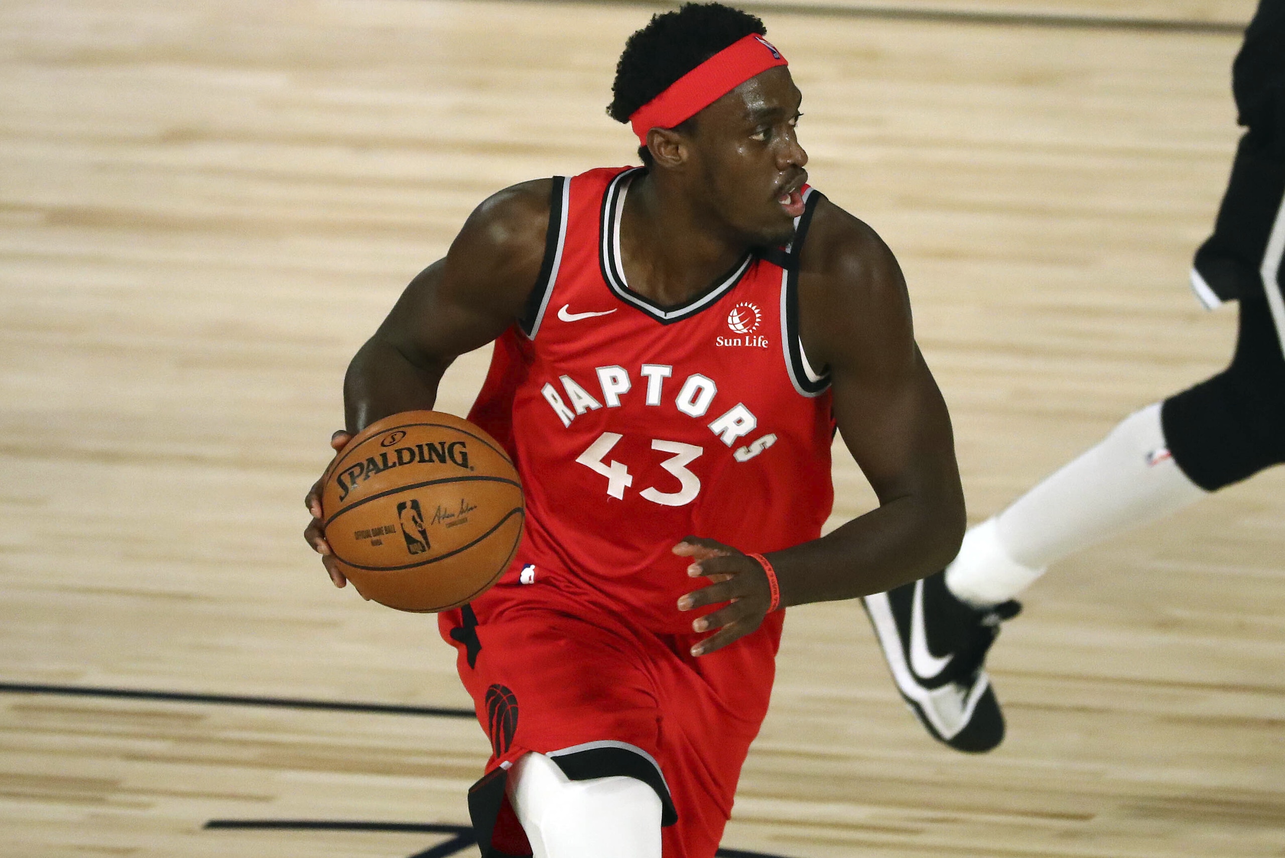 Toronto Raptors forward Pascal Siakam (43) moves the ball against the Brooklyn Nets during the first half of Game 4 of an NBA basketball first-round playoff series, Sunday, Aug. 23, 2020, in Lake Buena Vista, Fla. (Kim Klement/Pool Photo via AP)