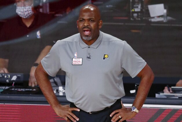Indiana Pacers head coach Nate McMillan watches the first half of Game 3 of an NBA basketball first-round playoff series against the Miami Heat, Saturday, Aug. 22, 2020, in Lake Buena Vista, Fla. (Kim Klement/Pool Photo via AP)
