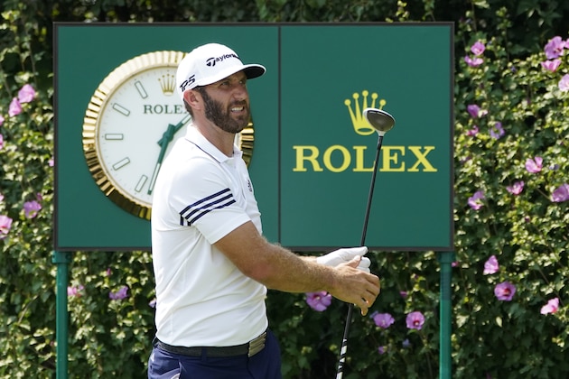 Dustin Johnson watches his tee shot during a practice round Wednesday, Aug. 26, 2020, for the BMW Championship golf tournament at the Olympia Fields Country Club in Olympia Fields, Ill. (AP Photo/Charles Rex Arbogast)