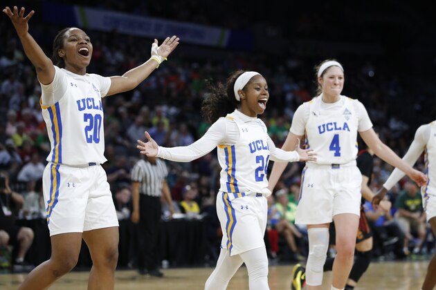 UCLA's Charisma Osborne, left, Japreece Dean, center, and Lindsey Corsaro celebrate after a play against Southern California during the second half of an NCAA college basketball game in the quarterfinal round of the Pac-12 women's tournament Friday, March 6, 2020, in Las Vegas. (AP Photo/John Locher)