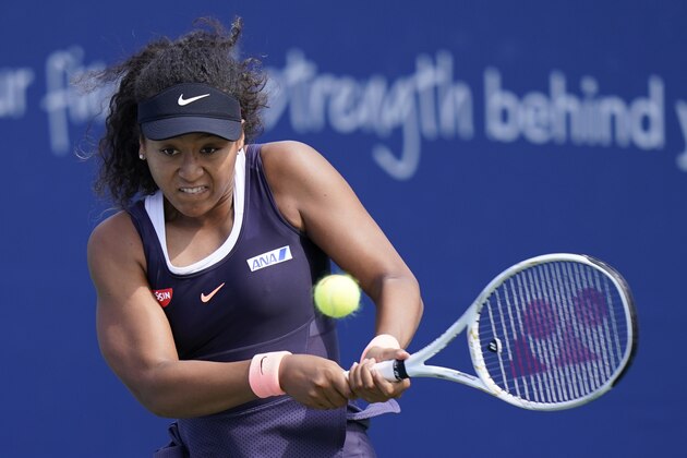 Naomi Osaka, of Japan, returns a shot to Anett Kontaveit, of Estonia, during the quarterfinals at the Western & Southern Open tennis tournament Wednesday, Aug. 26, 2020, in New York. (AP Photo/Frank Franklin II) Naomi Osaka, of Japan, returns a shot to Anett Kontaveit, of Estonia, during the quarterfinals at the Western & Southern Open tennis tournament Wednesday, Aug. 26, 2020, in New York. (AP Photo/Frank Franklin II)