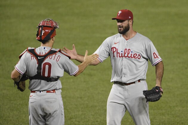 Philadelphia Phillies relief pitcher Brandon Workman, right, and Philadelphia Phillies catcher J.T. Realmuto (10) celebrate after the team's baseball game against the Washington Nationals, Wednesday, Aug. 26, 2020, in Washington. The Phillies won 3-2. (AP Photo/Nick Wass) Philadelphia Phillies relief pitcher Brandon Workman, right, and Philadelphia Phillies catcher J.T. Realmuto (10) celebrate after the team's baseball game against the Washington Nationals, Wednesday, Aug. 26, 2020, in Washington. The Phillies won 3-2. (AP Photo/Nick Wass)