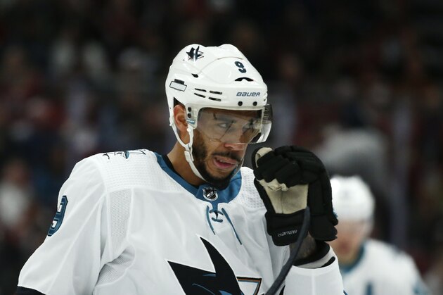 San Jose Sharks left wing Evander Kane wipes his visor during the first period of an NHL hockey game against the Arizona Coyotes Tuesday, Jan. 14, 2020, in Glendale, Ariz. The Coyotes defeated the Sharks 6-3. (AP Photo/Ross D. Franklin)
