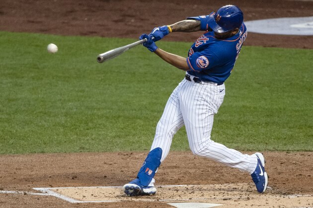 New York Mets' Dominic Smith hits an RBI double during the first inning of a baseball game against the Washington Nationals Wednesday, Aug. 12, 2020, in New York. (AP Photo/Frank Franklin II)