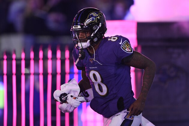 Baltimore Ravens quarterback Lamar Jackson (8) runs onto the field during introductions before an NFL divisional playoff football game against the Tennessee Titans, Saturday, Jan. 11, 2020, in Baltimore. (AP Photo/Nick Wass)
