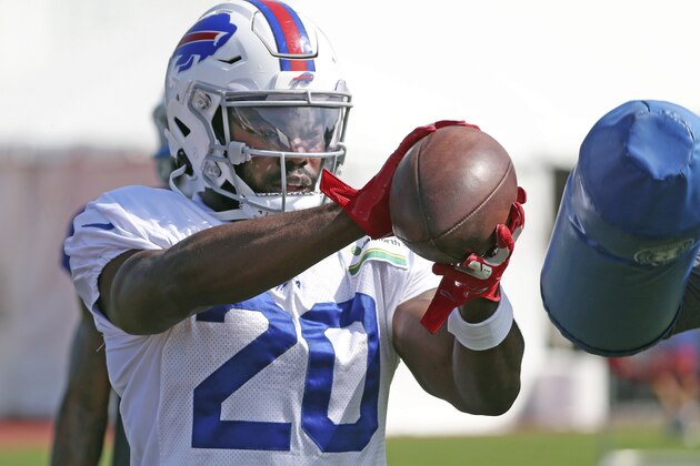 Buffalo Bills running back Zack Moss (20) catches a pass during an NFL football training camp in Orchard Park, N.Y., Sunday, Aug. 23, 2020. (James P. McCoy/The Buffalo News via AP, Pool)