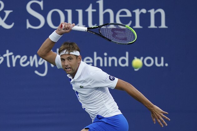 Filip Krajinovic, of Serbia, returns a shot by Milos Raonic, of Canada, during the quarterfinals at the Western & Southern Open tennis tournament Wednesday, Aug. 26, 2020, in New York. (AP Photo/Frank Franklin II)
