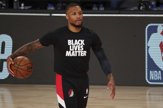 Portland Trail Blazers guard Damian Lillard (0) warms up before Game 2 of an NBA basketball first-round playoff series against the Los Angeles Lakers, Thursday, Aug. 20, 2020, in Lake Buena Vista, Fla. (Kim Klement/Pool Photo via AP) Portland Trail Blazers guard Damian Lillard (0) warms up before Game 2 of an NBA basketball first-round playoff series against the Los Angeles Lakers, Thursday, Aug. 20, 2020, in Lake Buena Vista, Fla. (Kim Klement/Pool Photo via AP)