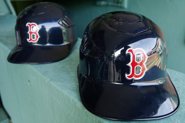 Boston Red Sox batting helmets in the dug out before a baseball game against the Tampa Bay Rays Monday, April 17, 2017, in Boston. (AP Photo/Michael Dwyer)