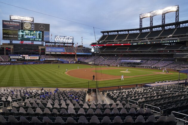 Miami Marlins starting pitcher Elieser Hernandez throws in the first inning of a baseball game against the New York Mets as cardboard cutouts of spectators populate the stands in the lower sections of Citi Field, Wednesday, Aug. 26, 2020, in New York. (AP Photo/John Minchillo)