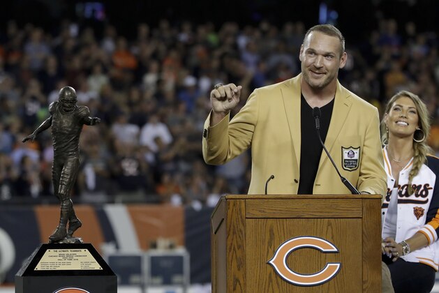 Former Chicago Bears and Hall of Fame linebacker Brian Urlacher speaks during ra Ring of Excellence ceremony by the Bears during the halftime of an NFL football game Monday, Sept. 17, 2018, in Chicago. (AP Photo/Nam Y. Huh)