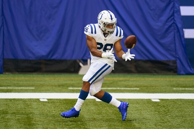 Indianapolis Colts running back Jonathan Taylor (28) makes a catch during practice at the NFL team's football training camp at Lucas Oil Stadium in Indianapolis, Monday, Aug. 24, 2020. (AP Photo/Michael Conroy)