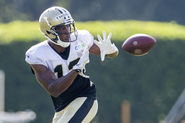 New Orleans Saints wide receiver Michael Thomas (13) catches the ball during NFL football training camp in Metairie, La., Friday, Aug. 21, 2020. (David Grunfeld/The Advocate via AP, Pool)