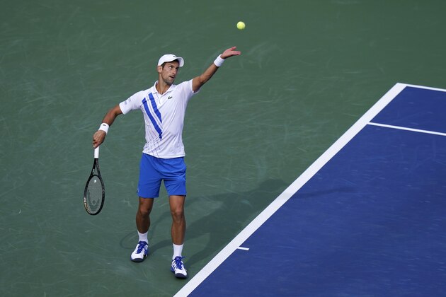 Novak Djokovic, of Serbia, serves to Jan-Lennard Struff, of Germany, during the quarterfinals at the Western & Southern Open tennis tournament Wednesday, Aug. 26, 2020, in New York. (AP Photo/Frank Franklin II)