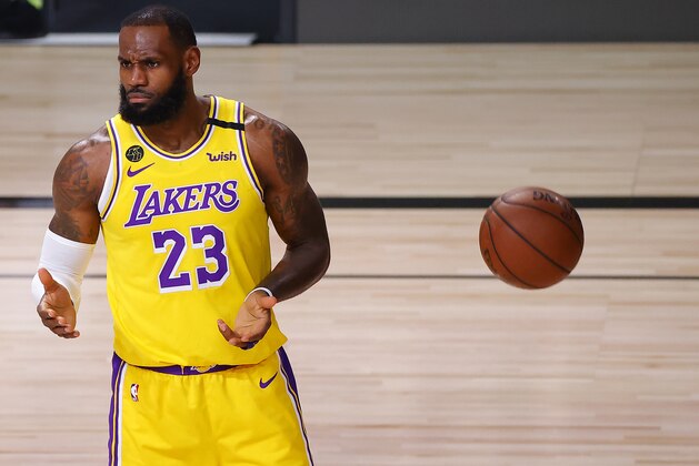 Los Angeles Lakers' LeBron James reacts to a foul during the first quarter of Game 2 of an NBA basketball first-round playoff series against the  Portland Trail Blazers, Thursday, Aug. 20, 2020, in Lake Buena Vista, Fla. (Kevin C. Cox/Pool Photo via AP)
