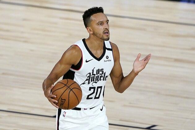 Los Angeles Clippers' Landry Shamet (20) eyes a teammate as he dribbles up court against the Dallas Mavericks during the first half of an NBA basketball game Thursday, Aug. 6, 2020 in Lake Buena Vista, Fla. (AP Photo/Ashley Landis, Pool) Los Angeles Clippers' Landry Shamet (20) eyes a teammate as he dribbles up court against the Dallas Mavericks during the first half of an NBA basketball game Thursday, Aug. 6, 2020 in Lake Buena Vista, Fla. (AP Photo/Ashley Landis, Pool)