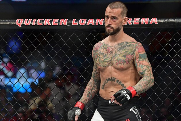 CM Punk stands in his corner before a welterweight bout at UFC 203 on Saturday, Sept. 10, 2016, in Cleveland. Mickey Gall won via submission. (AP Photo/David Dermer)