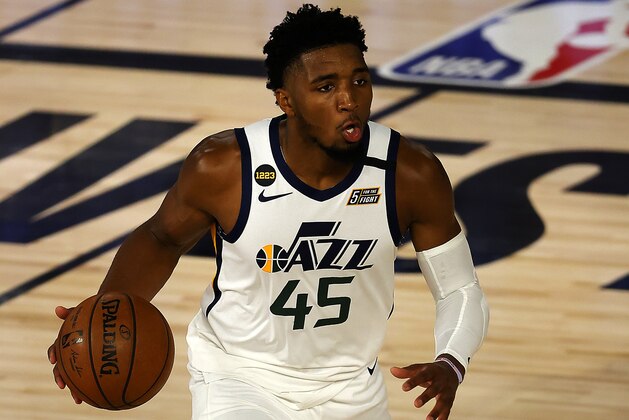 Donovan Mitchell of the Utah Jazz dribbles the ball during the second halfof Game 5 of an NBA basketball first-round playoff series, Tuesday, Aug. 25, 2020, in Lake Buena Vista, Fla. (Mike Ehrmann/Pool Photo via AP)