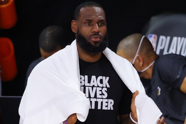 Los Angeles Lakers' LeBron James stands on the sidelines during the second quarter against the Portland Trail Blazers in Game 2 of an NBA basketball first-round playoff series, Thursday, Aug. 20, 2020, in Lake Buena Vista, Fla. (Kevin C. Cox/Pool Photo via AP)