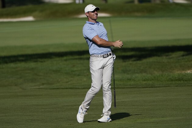 Rory McIlroy watches his approach shot on the ninth hole during the second round of the BMW Championship golf tournament, Friday, Aug. 28, 2020, at Olympia Fields Country Club in Olympia Fields, Ill. (AP Photo/Charles Rex Arbogast)