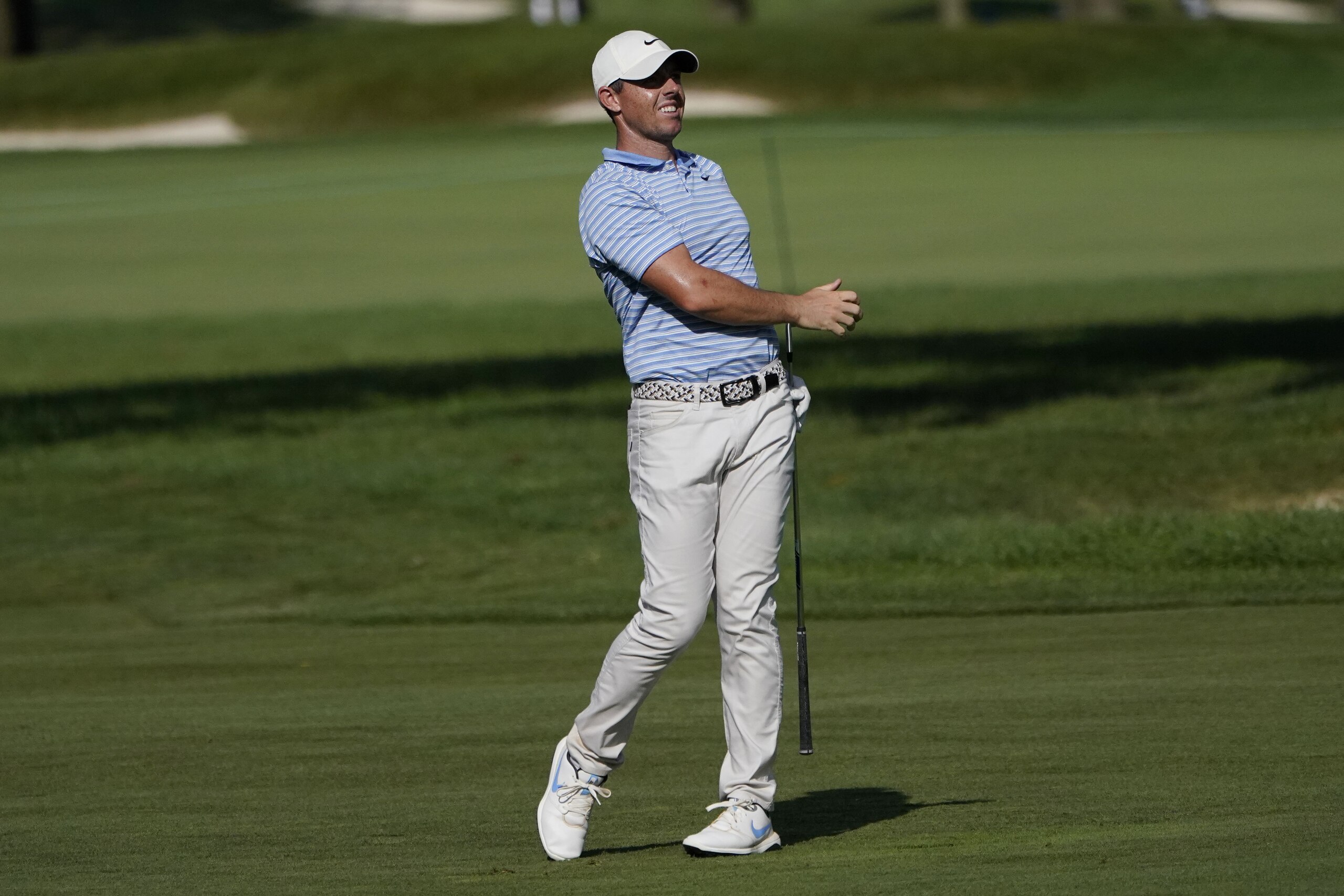 Rory McIlroy watches his approach shot on the ninth hole during the second round of the BMW Championship golf tournament, Friday, Aug. 28, 2020, at Olympia Fields Country Club in Olympia Fields, Ill. (AP Photo/Charles Rex Arbogast)
