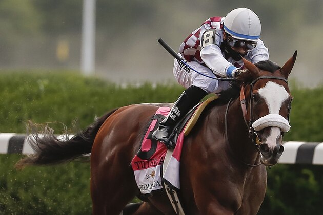 Tiz the Law (8), with jockey Manny Franco up, approaches the finish line on his way to win the152nd running of the Belmont Stakes horse race, Saturday, June 20, 2020, in Elmont, N.Y. (AP Photo/Seth Wenig)
