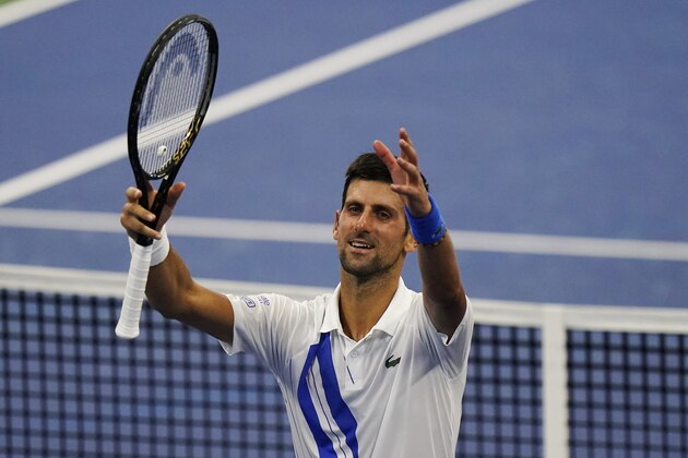 Novak Djokovic, of Serbia, celebrates winning his match against Roberto Bautista Agut, of Spain, during the semifinals at the Western & Southern Open tennis tournament Friday, Aug. 28, 2020, in New York. (AP Photo/Frank Franklin II)