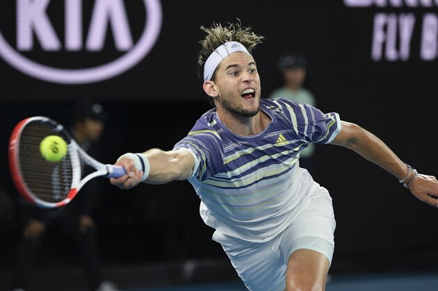 FILE - In this Feb. 2, 2020, file photo, Austria's Dominic Thiem makes a forehand return to Serbia's Novak Djokovic during the men's singles final at the Australian Open tennis championship in Melbourne, Australia. Thiem is scheduled to play in the U.S. Open, scheduled for Aug. 31-Sept. 13, 2020.(AP Photo/Andy Brownbill, File)