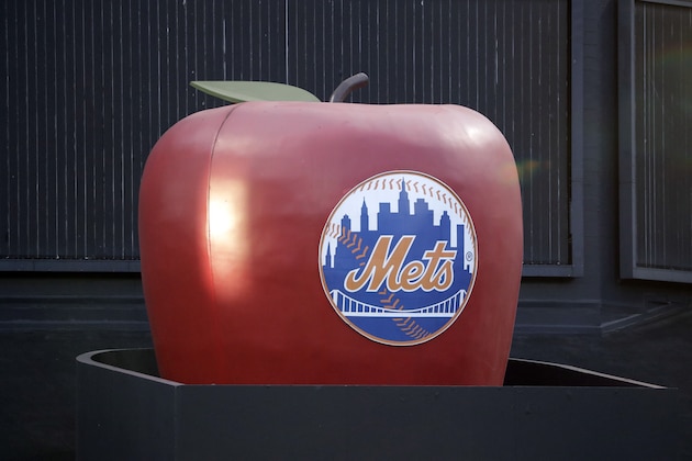 The apple in center field at CitiField, home of the New York Mets, is up before the start of a baseball game between the New York Mets and the Chicago Cubs, Tuesday, Aug. 27, 2019, in New York. The apple pops up every time a Metss' player hits a home run. (AP Photo/Kathy Willens)