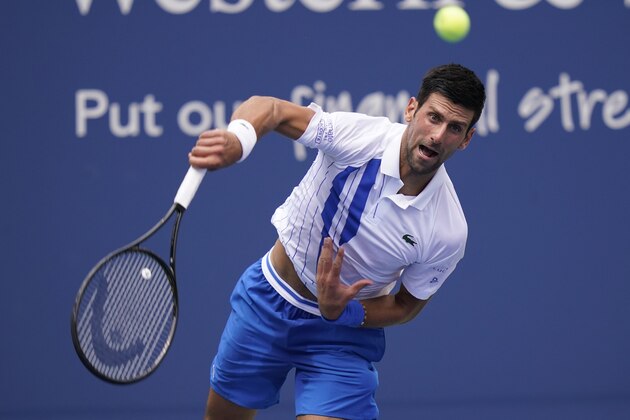 Novak Djokovic, of Serbia, returns a shot to Roberto Bautista Agut, of Spain, during the semifinals at the Western & Southern Open tennis tournament Friday, Aug. 28, 2020, in New York. (AP Photo/Frank Franklin II)